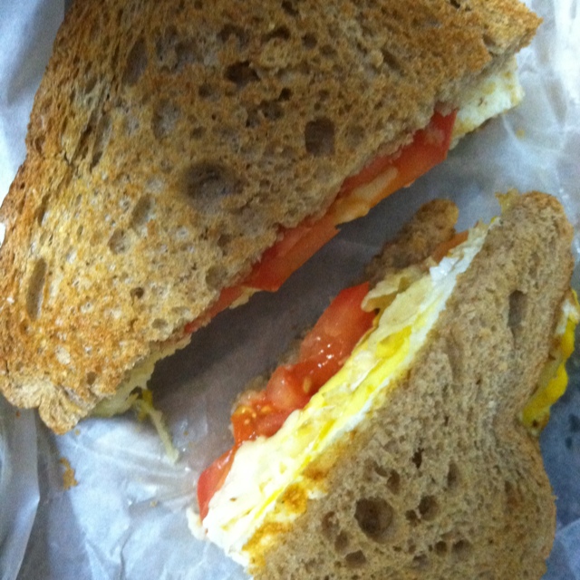 Fried Egg Sandwich with Tomatoes on Wheat Bread Fried Egg Sandwich with Tomatoes on Wheat Bread